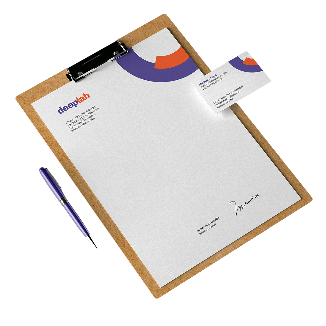 Purple and orange business letterhead on a clipboard beside a matching business card and pen