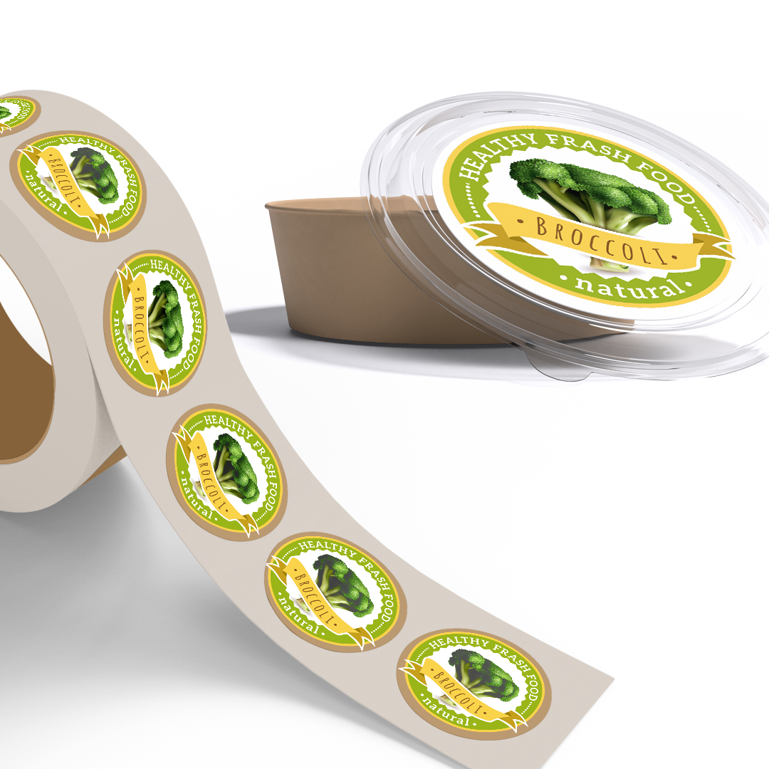 Roll of printed food packaging labels beside labelled takeaway containers